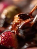 Close up of Strawberries and Nuts Dipped in Melted Chocolate. photo