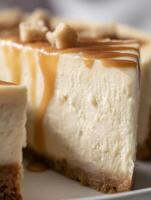 Close Up of Creamy Cheesecake Slice with Caramel Drizzle and Crumble Topping. photo