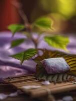 Close Up of Sweet Mochi on a Leaf with Soft Background Lighting. photo
