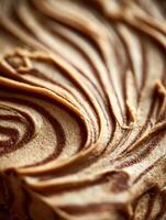 Close up of Swirled Brown and Beige Frosting Texture. A Detailed Image of Creamy Dessert Topping. photo