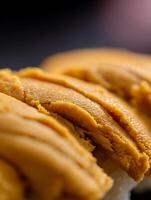 Close Up of Uni Sushi, Delicious Orange Sea Urchin Texture. photo
