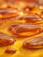 Abstract Golden Liquid Drops, Close Up Texture Background. photo