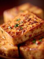 Close Up of Pan-Seared Tofu Cubes with Herbs and Spices. photo