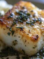 Close Up of Pan-Seared Fish Fillet with Herbs. photo