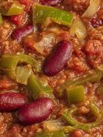 Close Up of Kidney Bean Chili with Green Bell Peppers and Onions. A vibrant image perfect for food blogs, recipe websites, and culinary publications. photo