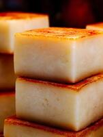 Close up of Creamy Flan Cubes with Caramelized Topping. photo
