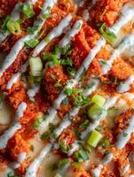 Close Up of Buffalo Chicken Pizza with Ranch Dressing and Green Onions. photo