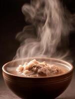 Steaming Hot Bowl of Broth with Meat and Noodles. A close up image of a delicious and aromatic Asian soup. photo