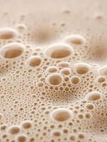 Close Up of Creamy Beige Bubbles, Abstract Texture Background. photo