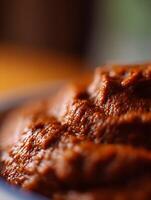 Close Up of Rich Brown Sauce or Paste Texture, Culinary Background. photo