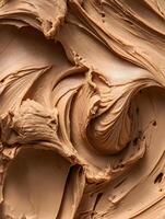 Creamy Swirls of Hazelnut Spread A Close Up Food Texture Image. photo