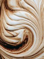 Abstract Swirled Cream and Coffee Texture, Close Up Food Photography. photo