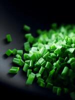 Close up of Freshly Chopped Green Onions on Dark Surface. photo