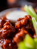 Close up of Buffalo Wings with Celery and Ranch Dressing. photo