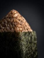Close up of Brown Rice Onigiri Wrapped in Seaweed. A Detailed Image of Japanese Rice Balls. photo