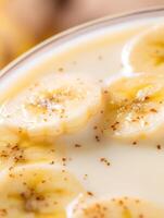 Close Up of Creamy Dessert with Sliced Bananas and Cinnamon. photo