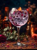 Gin Cocktail with Rose Petals and Orange Garnish Close up image of a refreshing drink. photo