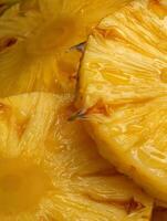 Close up of juicy pineapple slices, showing texture and detail. photo