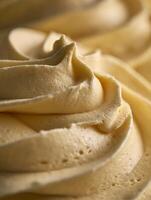Close Up of Creamy Buttercream Frosting Texture, Swirled and Delicious. photo