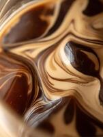 Abstract Swirl of Coffee and Cream A Close Up of Textured Latte Art. photo