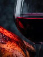 Roasted Chicken and Red Wine A Culinary Delight. Close up image perfect for food blogs, magazines and restaurant menus. photo