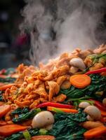 Close up of Steaming Chicken Stir Fry with Vegetables. A Delicious and Aromatic Asian Cuisine Dish. photo