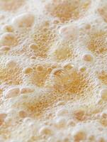 Close Up of Boiling Liquid with Bubbles, Abstract Texture. photo
