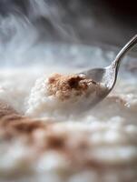 Close Up of Creamy Rice Pudding with Cinnamon. A delicious and warm image perfect for food blogs and culinary websites. photo
