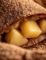 Close up of Apple Strudel with Cinnamon Sugar Topping, Showing Juicy Apple Filling. photo