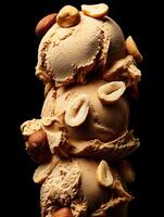 Delicious Nutty Ice Cream Scoops Close Up. A tempting image of three scoops of creamy caramel ice cream topped with roasted peanuts and hazelnuts. photo