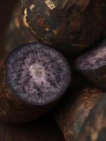 Close up of vibrant purple potato slices, revealing intricate texture and color. photo