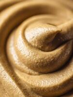 Close Up of Creamy Brown Mustard Texture, Swirled and Rich. photo