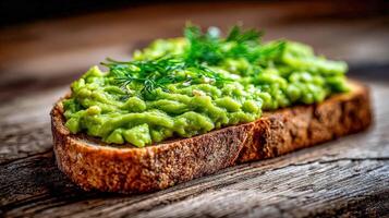 Avocado toast with fresh dill on a wooden surface photo