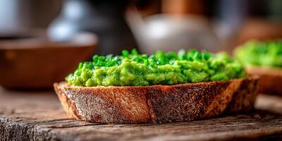 Avocado toast with fresh chives on a wooden cutting board photo