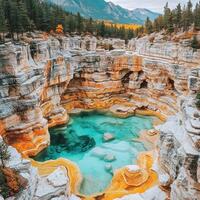 Majestic rock formations cradle sparkling turquoise waters under a bright blue sky photo