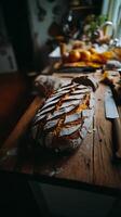 Artisan Bread on Rustic Wooden Table Close Up of Golden Crust and Flour Dust. photo