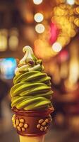 Close up of a Delicious Pistachio and Vanilla Swirl Ice Cream Cone at Night. photo