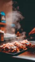 Steaming Hot Okonomiyaki on a Griddle Close Up of Japanese Savory Pancake. photo
