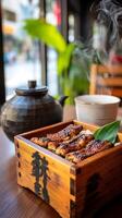 Steaming Unagi Don in a Traditional Wooden Box. A close up view of a delicious Japanese eel dish served on rice. photo