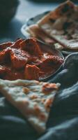 Close up of Chicken Tikka Masala with Naan Bread. A delicious Indian dish ready to be enjoyed. photo