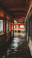 Tranquil Passageway A Serene View of a Japanese Shrine Over Water. photo