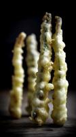Close Up of Crispy Fried Asparagus Tempura on Wooden Surface. photo