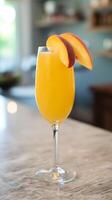 Refreshing Peach Bellini Cocktail in a Champagne Flute. photo