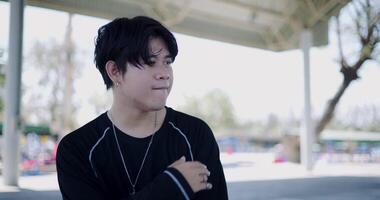 Handheld selective focus shot, Young Asian man with dancing skills, moving body coolly and stylishly to the rhythm. Solo dance. video