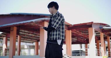 Handheld low angle view shot, Young man with dancing skills is practicing new moves by himself. Holiday activity. Solo dance. video