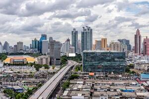 A city skyline with a highway and buildings photo