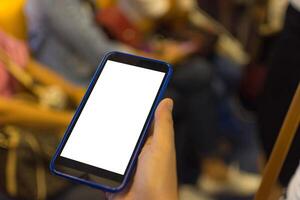 A person holding a cell phone with a blank screen photo