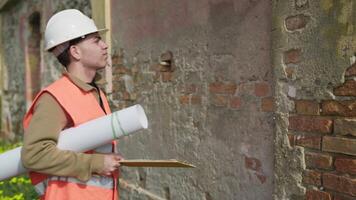 Architect On The Construction Site Putting On The Helmet For Safety video