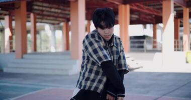 Handheld shot, Young man with dancing skills is practicing new moves by himself. Holiday activity. video