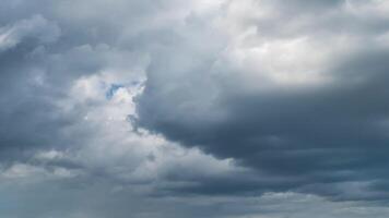 A large field with a large cloud in the sky video
